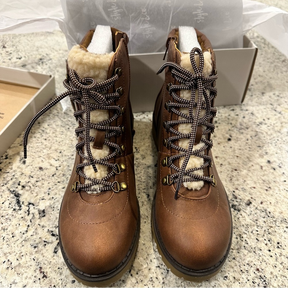 Brand new in box!! NWT! Brown combat boots with fur lining.